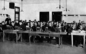 YEOMEN'S SCHOOL, NAVAL TRAINING STATION: Newport, Rhode Island. In order to perform efficiently and expeditiously the clerical work on board a modern warship, yeomen must be proficient in stenography and typewriting; hence this group of young enlisted men resembling a class in a business college.